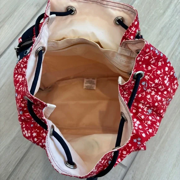 LeSportsac Small Edie Backpack in red  with a white and blue floral pattern. - Picture 8 of 12